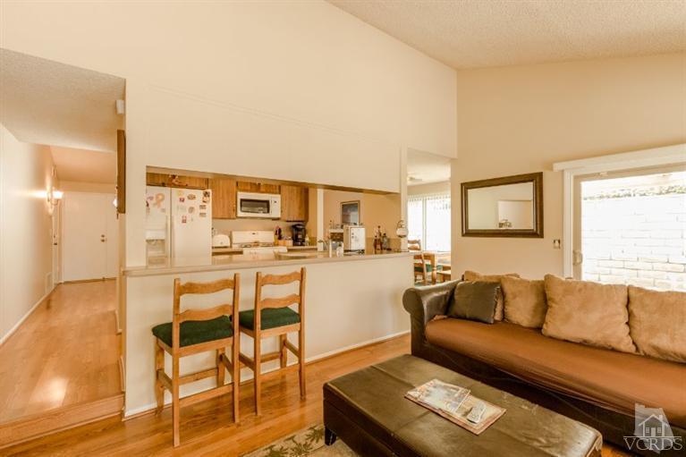 1888 Fitzgerald Road Simi Valley, CA 93065 - Photo 15 of 28 a living room with furniture and a kitchen view