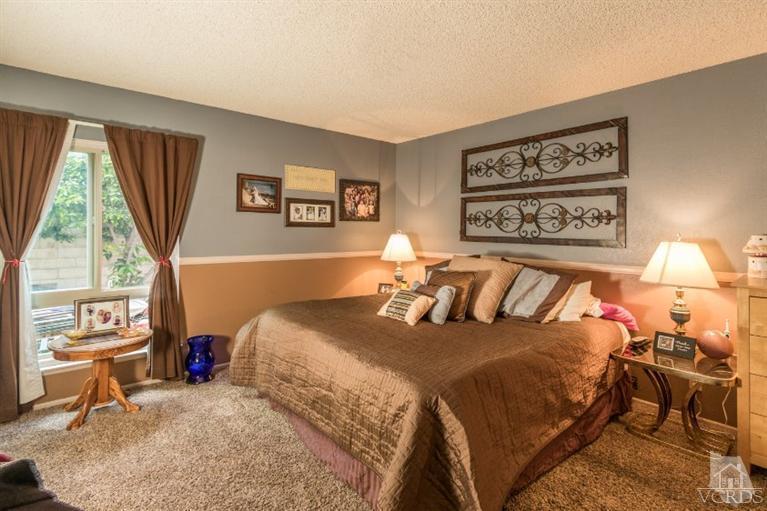 1888 Fitzgerald Road Simi Valley, CA 93065 - Photo 17 of 28 a bedroom with a bed and a window