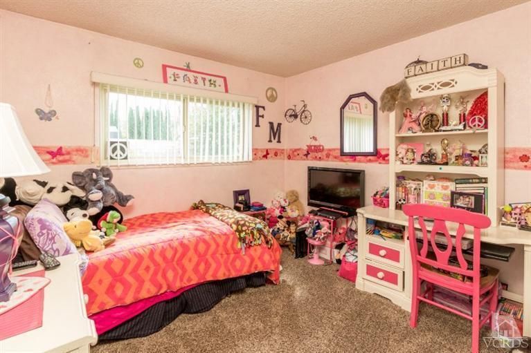 1888 Fitzgerald Road Simi Valley, CA 93065 - Photo 20 of 28 a bed room with a bed and a window
