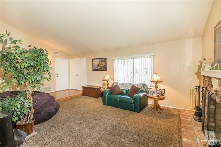 1888 Fitzgerald Road Simi Valley, CA 93065 - Photo 3 of 28 a living room with furniture and a potted plant