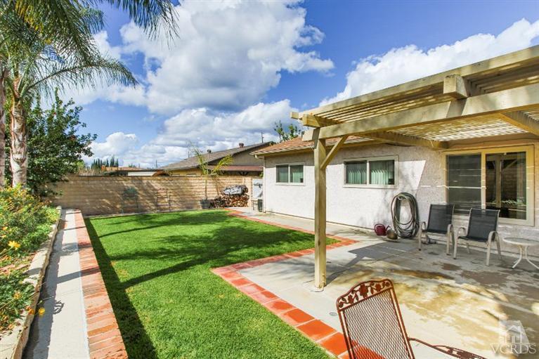 1888 Fitzgerald Road Simi Valley, CA 93065 - Photo 28 of 28 a front view of a house with garden and patio