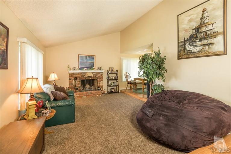 1888 Fitzgerald Road Simi Valley, CA 93065 - Photo 5 of 28 a living room with furniture and a fireplace