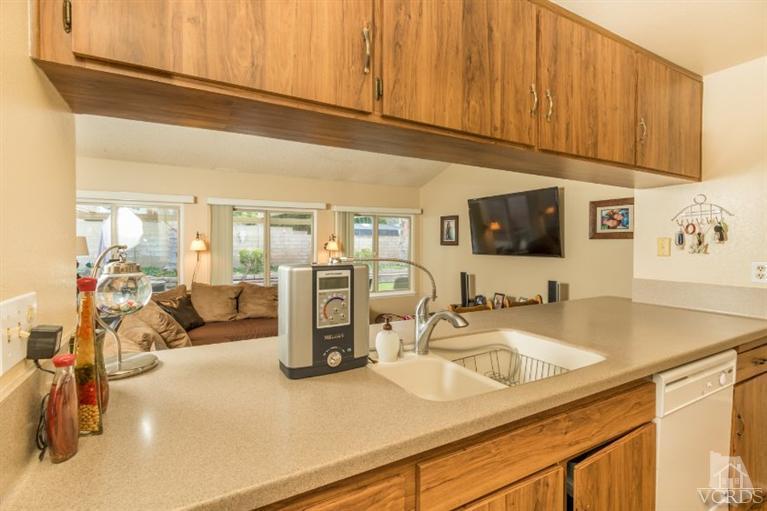 1888 Fitzgerald Road Simi Valley, CA 93065 - Photo 10 of 28 a kitchen with a sink a stove and cabinets