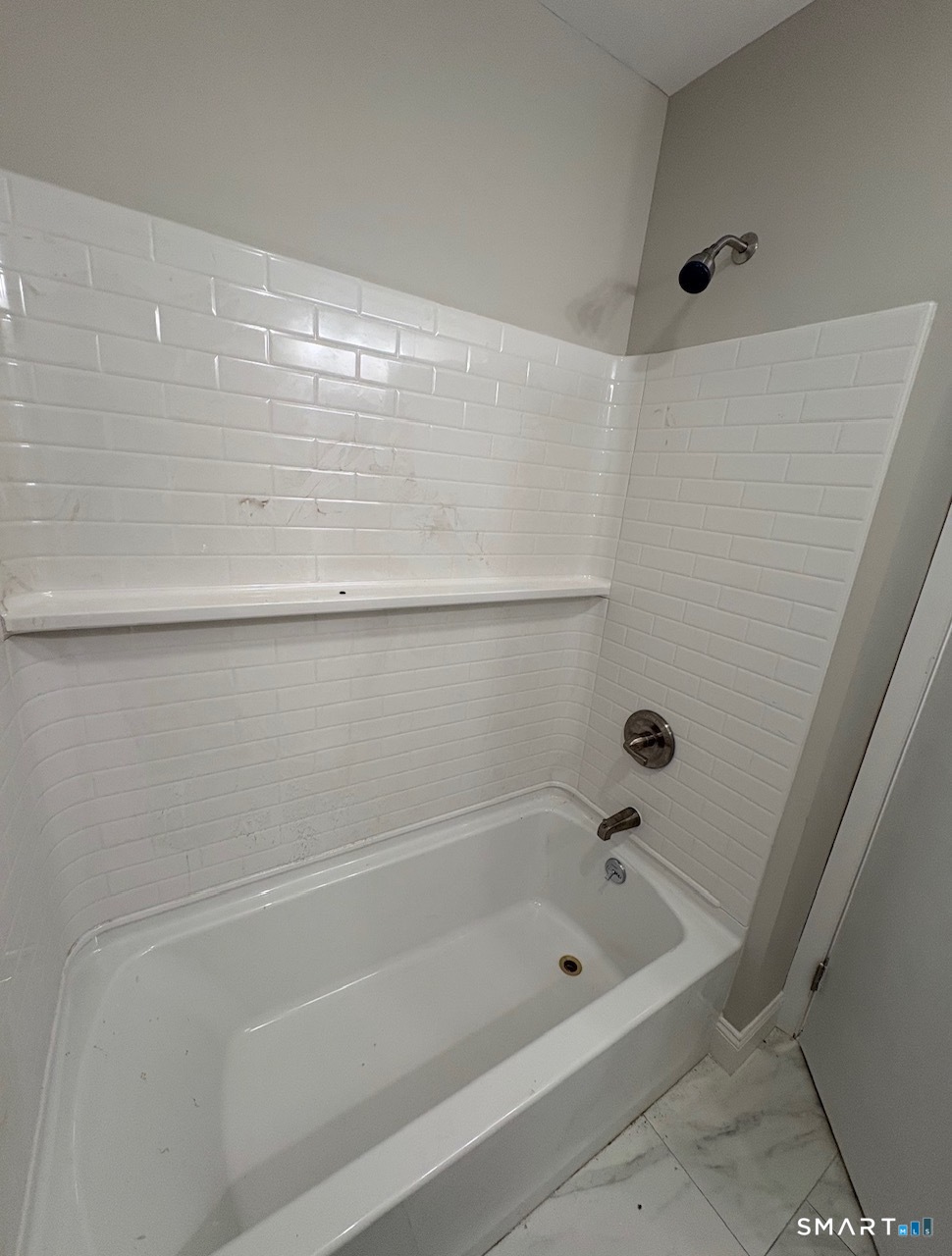 34 Center Street, Unit 2 Bristol, CT 06010 - Photo 7 of 13 a bathroom with a bathtub