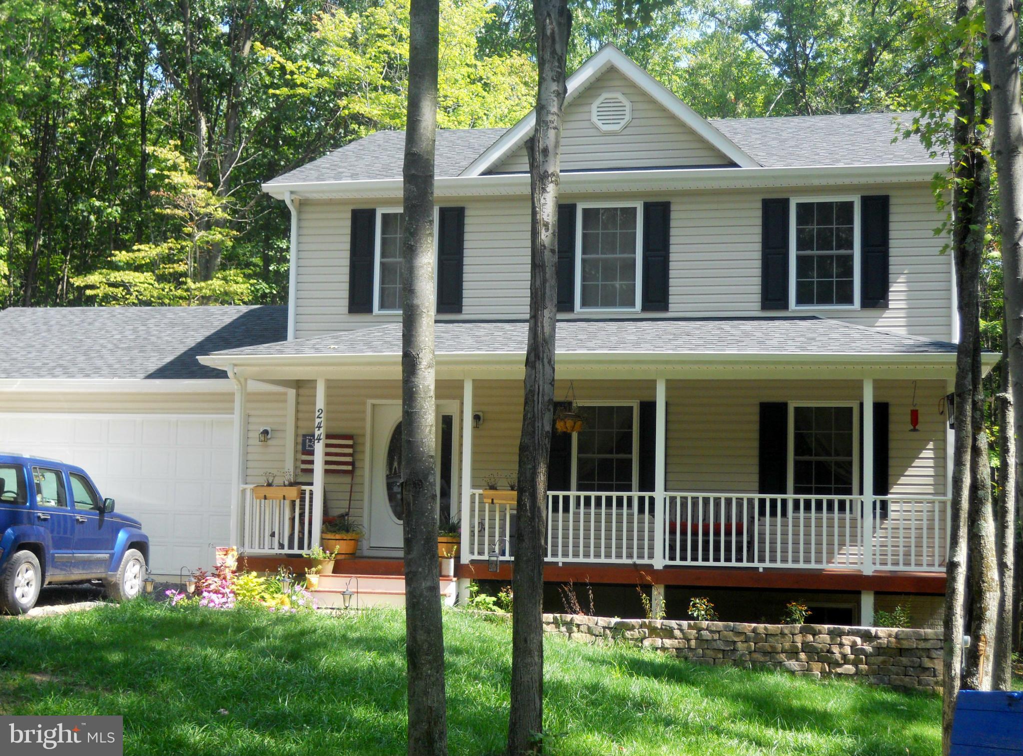 244 Fairview Church Road Gore, VA 22637 - Photo 2 of 30 a porch with a bench next to a yard