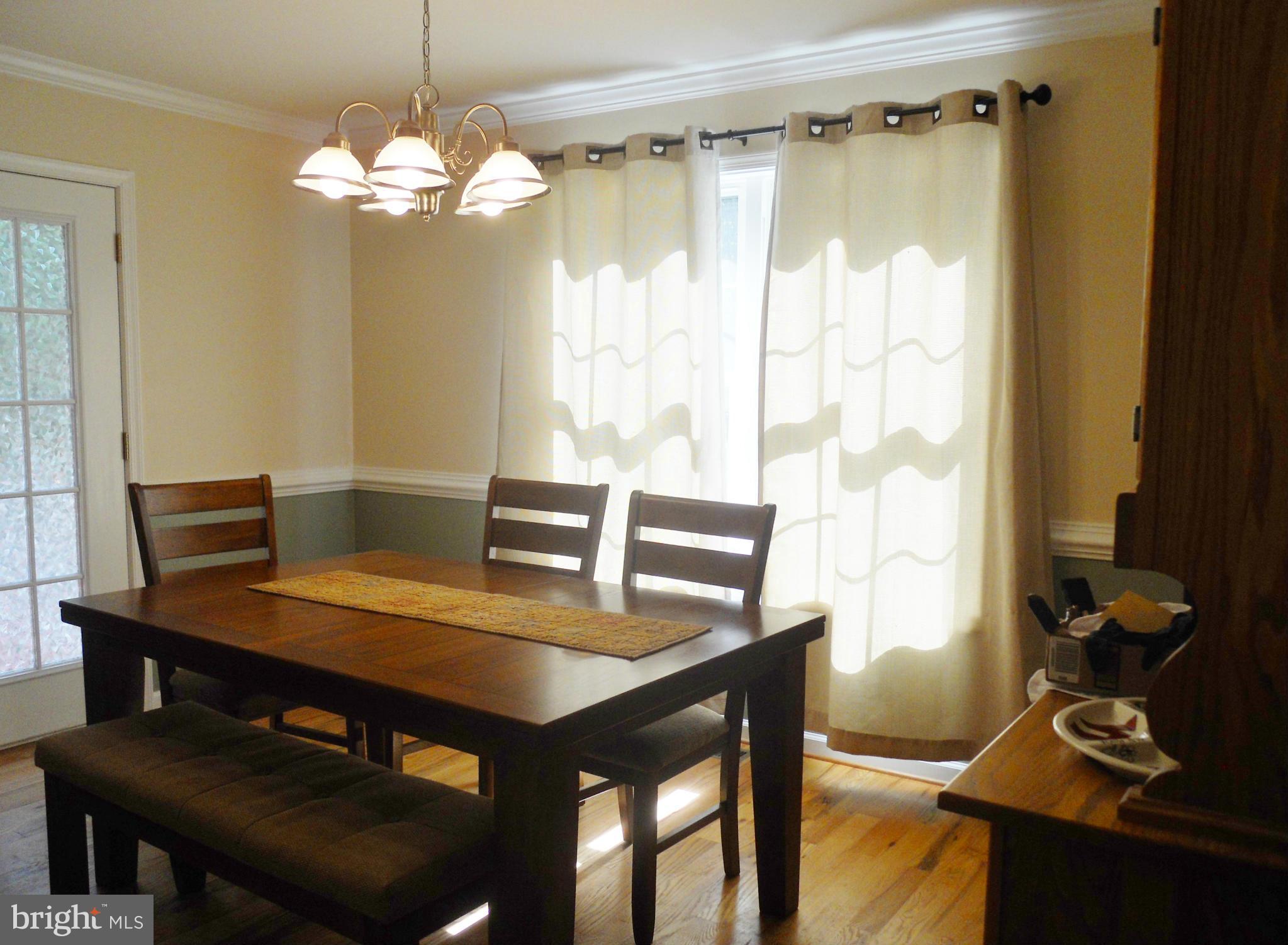 244 Fairview Church Road Gore, VA 22637 - Photo 15 of 30 a view of a dining room with furniture and wooden floor