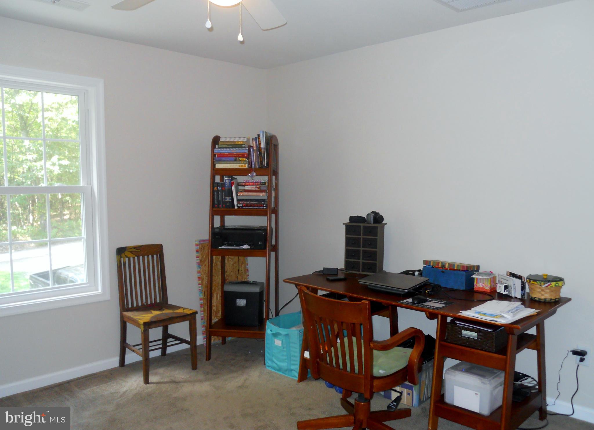 244 Fairview Church Road Gore, VA 22637 - Photo 22 of 30 a view of a workspace with furniture and a window