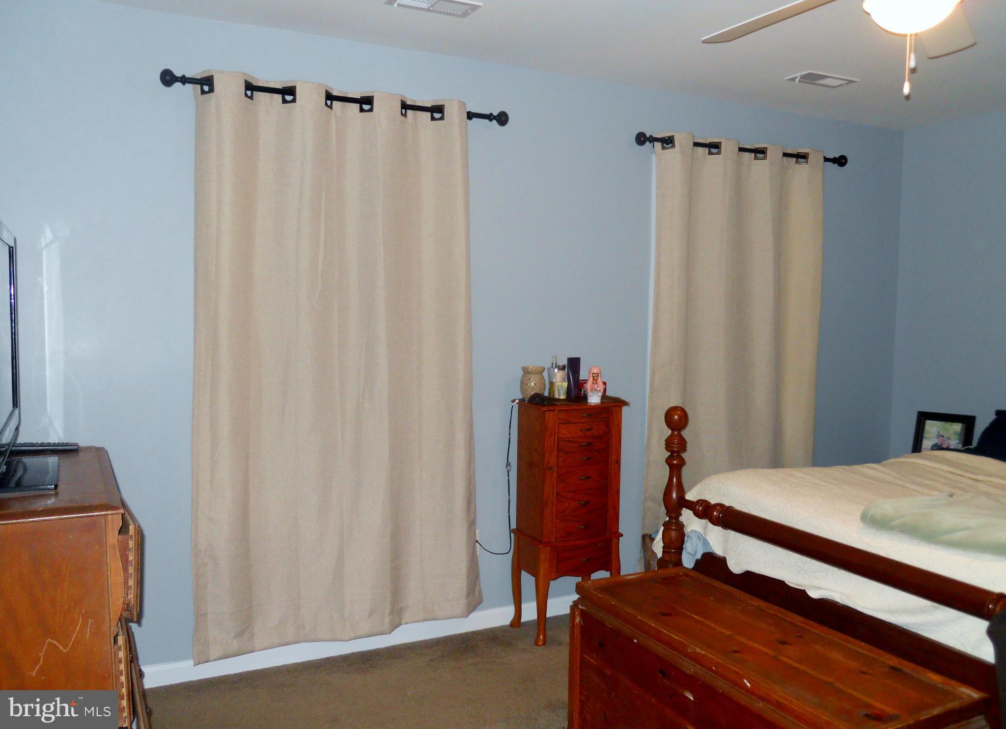 244 Fairview Church Road Gore, VA 22637 - Photo 23 of 30 a bedroom with a bed and a mirror