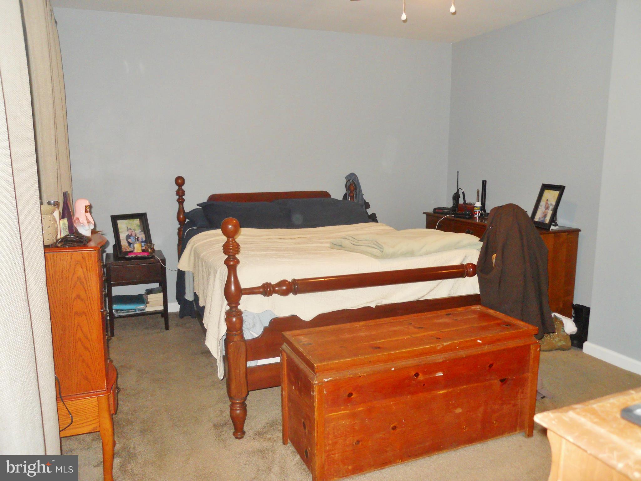 244 Fairview Church Road Gore, VA 22637 - Photo 24 of 30 a bed sitting in a bedroom next to a window