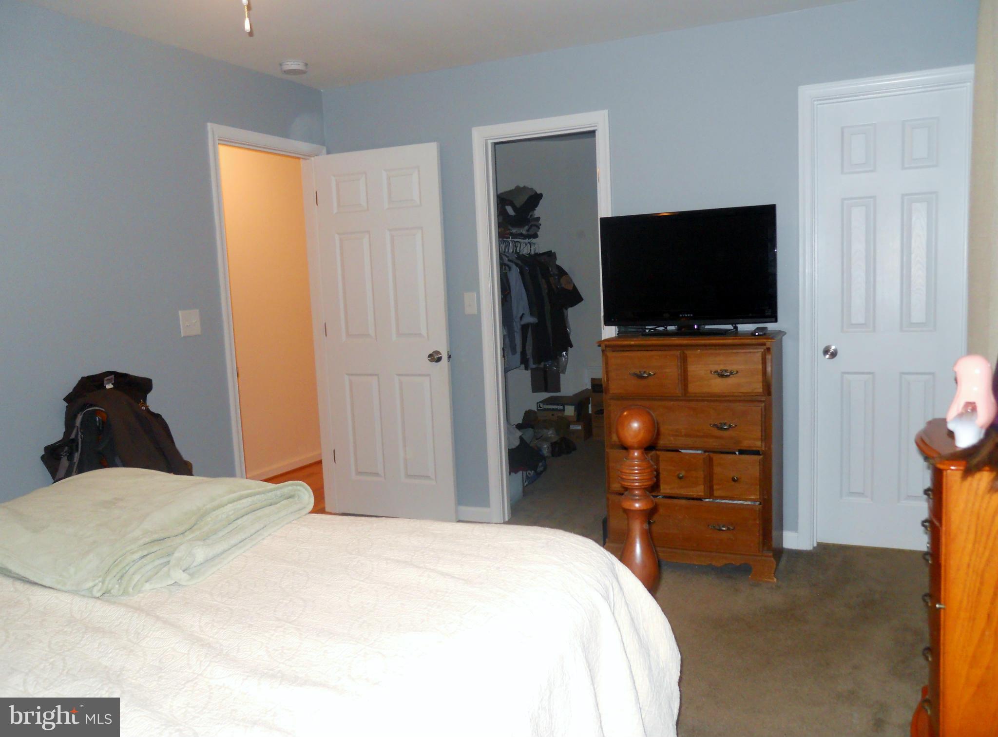 244 Fairview Church Road Gore, VA 22637 - Photo 25 of 30 a bedroom with a bed and a flat screen tv