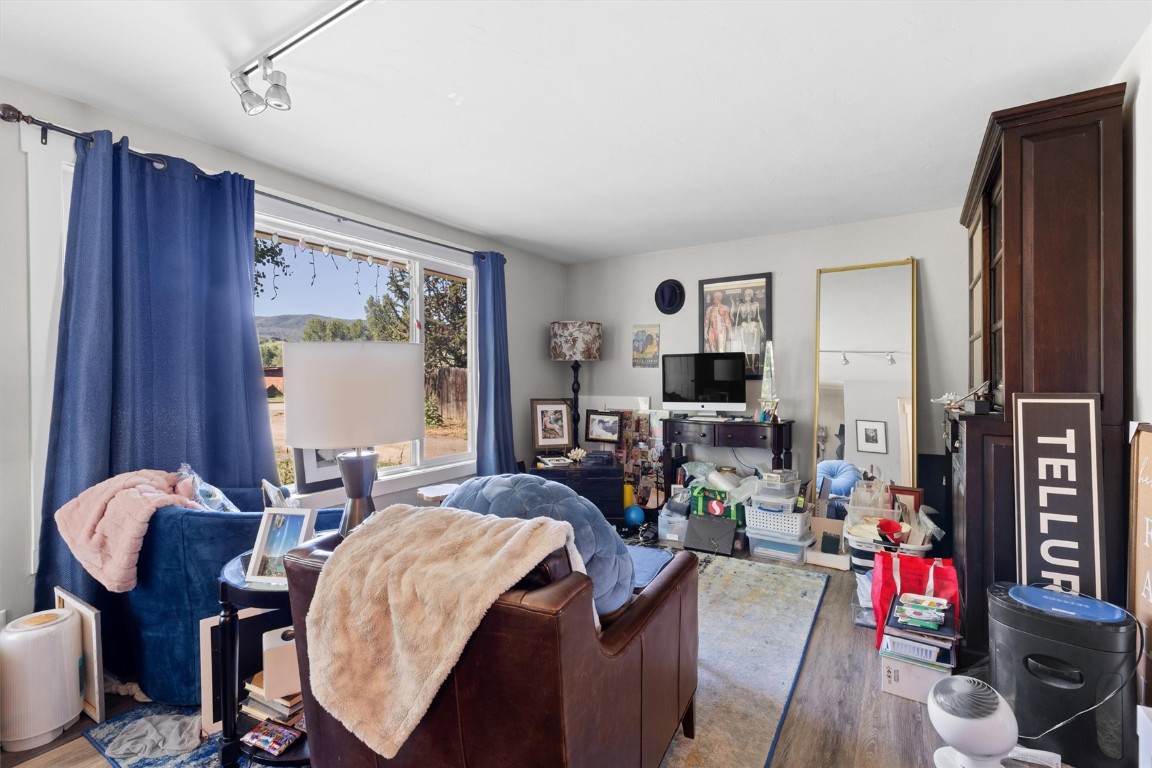 2646 Riverside Drive, Unit A Steamboat Springs, CO 80487 - Photo 2 of 12 a living room with furniture and a flat screen tv