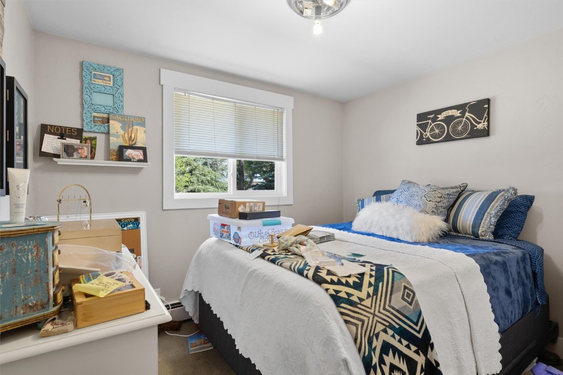 2646 Riverside Drive, Unit A Steamboat Springs, CO 80487 - Photo 4 of 12 a bedroom with a bed and a couch