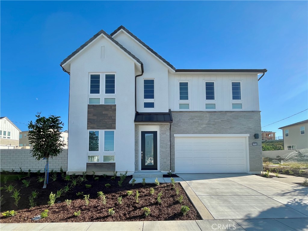 27510 Elderberry Drive Valencia, CA 91381 - Photo 1 of 60 a front view of a house with a yard