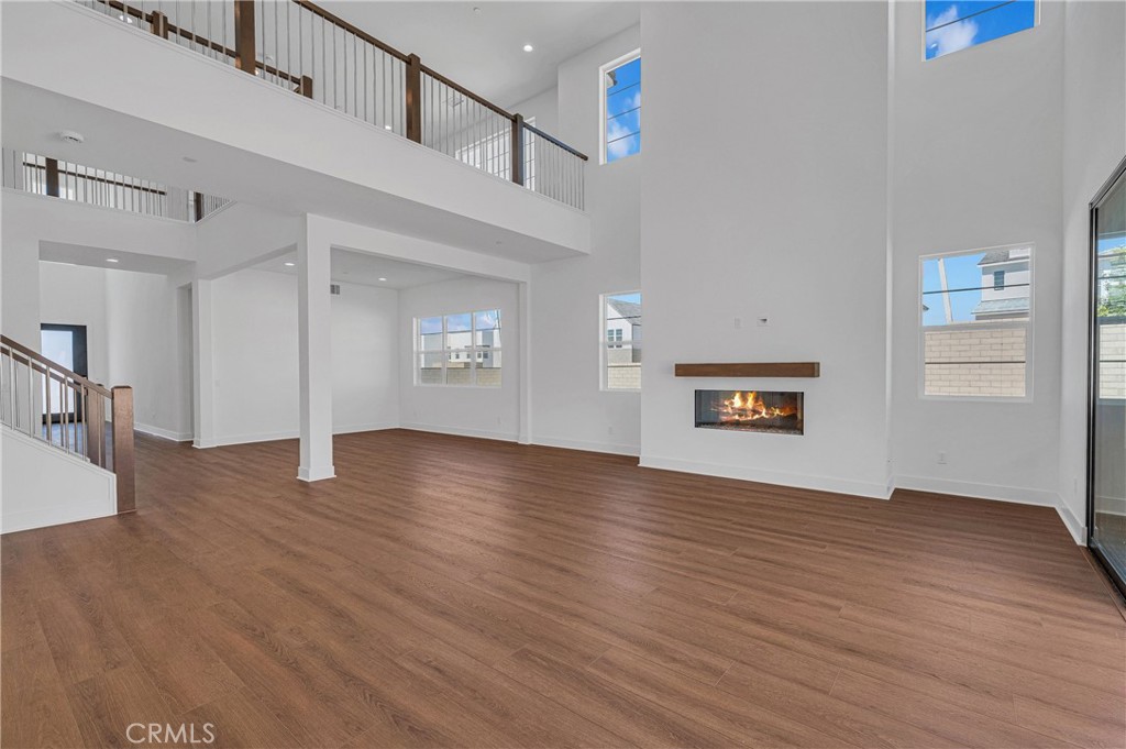 27510 Elderberry Drive Valencia, CA 91381 - Photo 11 of 60 a view of an empty room with wooden floor and a window