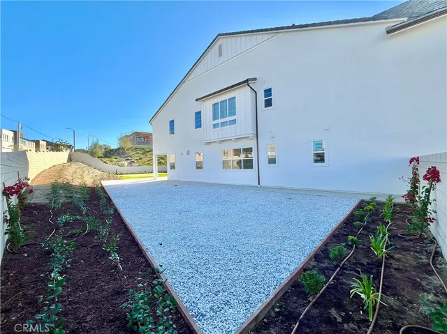 a backyard of a house with lots of green space