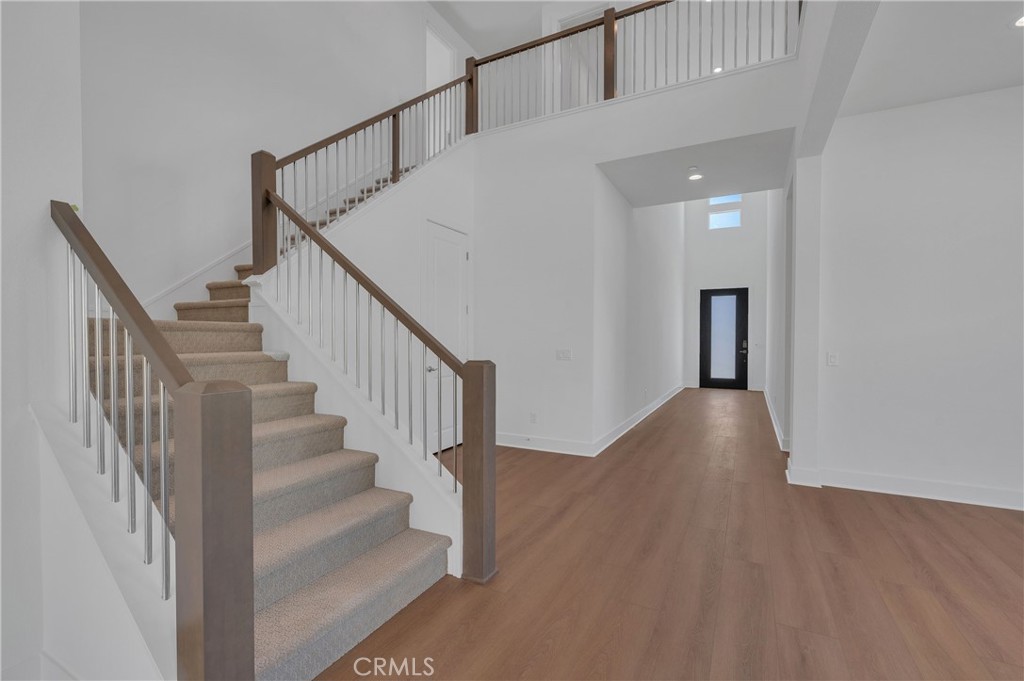 27510 Elderberry Drive Valencia, CA 91381 - Photo 23 of 60 a view of staircase with wooden floor and white walls