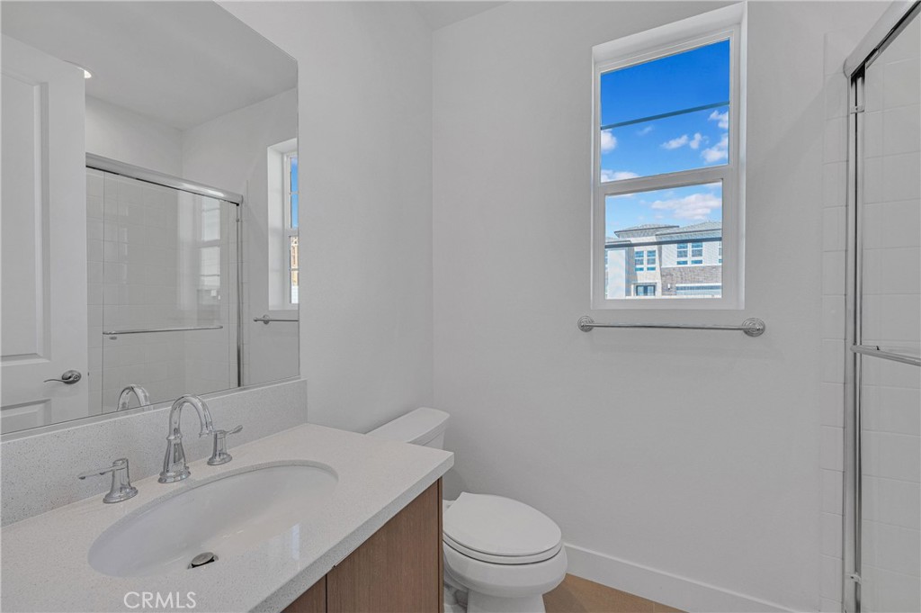 27510 Elderberry Drive Valencia, CA 91381 - Photo 26 of 60 a bathroom with a sink a toilet and shower