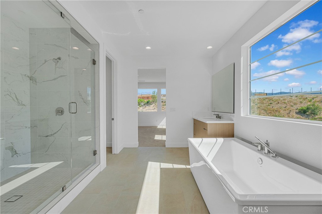 27510 Elderberry Drive Valencia, CA 91381 - Photo 36 of 60 a bathroom with a bathtub and a shower