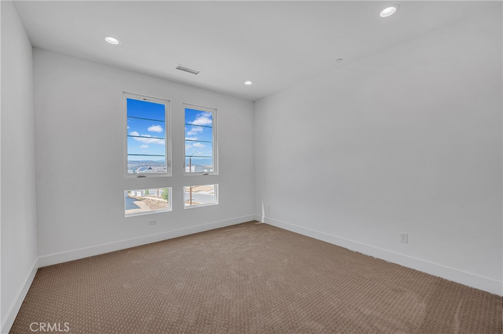 27510 Elderberry Drive Valencia, CA 91381 - Photo 39 of 60 a view of an empty room with a window