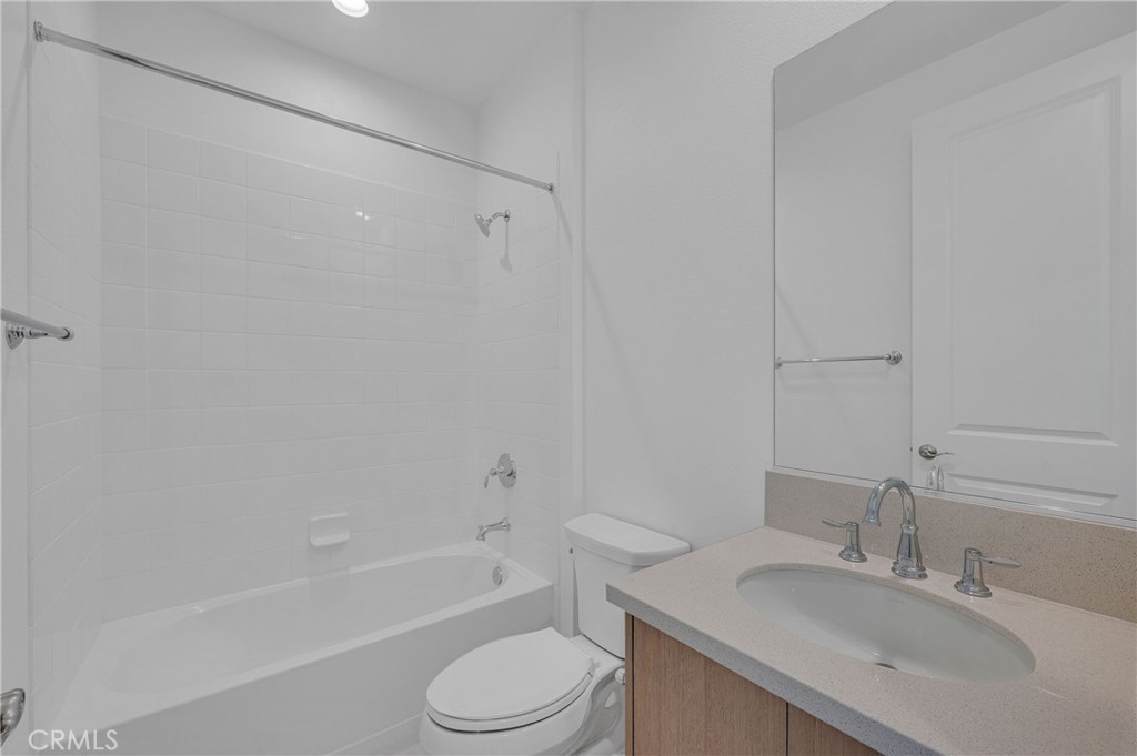 27510 Elderberry Drive Valencia, CA 91381 - Photo 41 of 60 a bathroom with a sink toilet vanity and bathtub