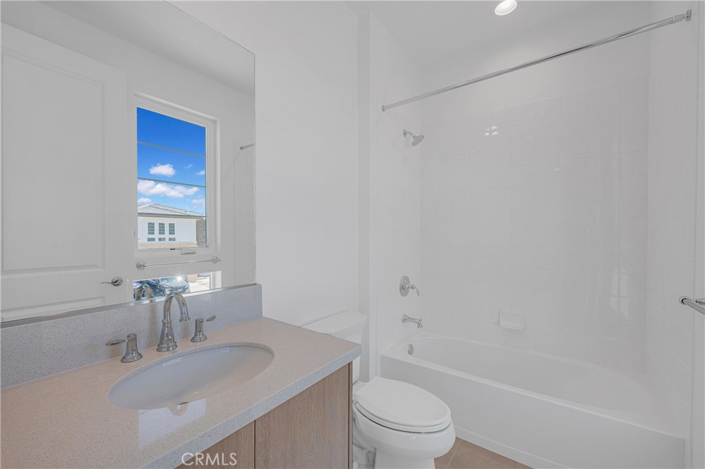 27510 Elderberry Drive Valencia, CA 91381 - Photo 44 of 60 a bathroom with a sink toilet and shower