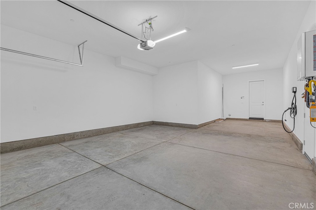 27510 Elderberry Drive Valencia, CA 91381 - Photo 49 of 60 a view of a room with cabinet and a ceiling fan