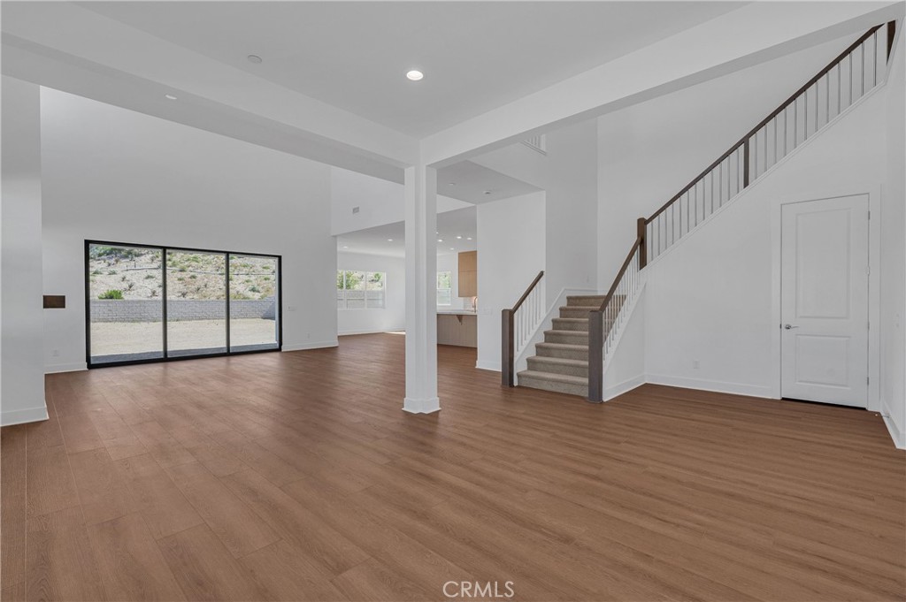 27510 Elderberry Drive Valencia, CA 91381 - Photo 6 of 60 a view of an empty room with wooden floor and stairs