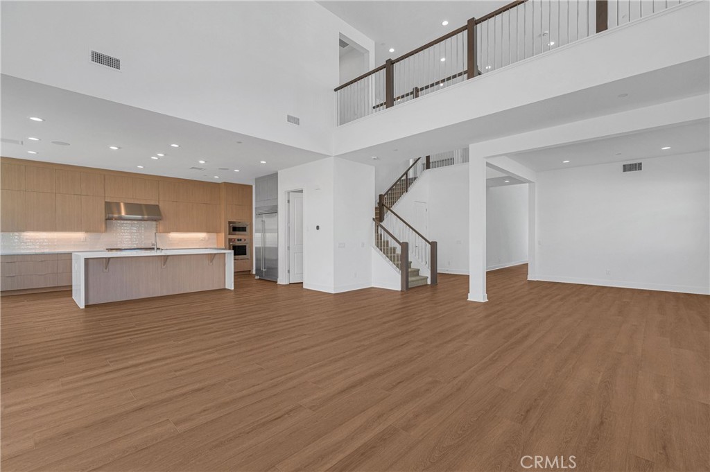 27510 Elderberry Drive Valencia, CA 91381 - Photo 9 of 60 a view of a kitchen with wooden floor and stairs