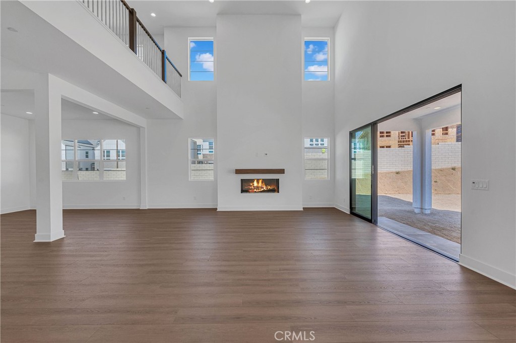 27510 Elderberry Drive Valencia, CA 91381 - Photo 10 of 60 a view of an empty room with wooden floor and a window