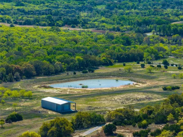 a view of a swimming pool and a yard