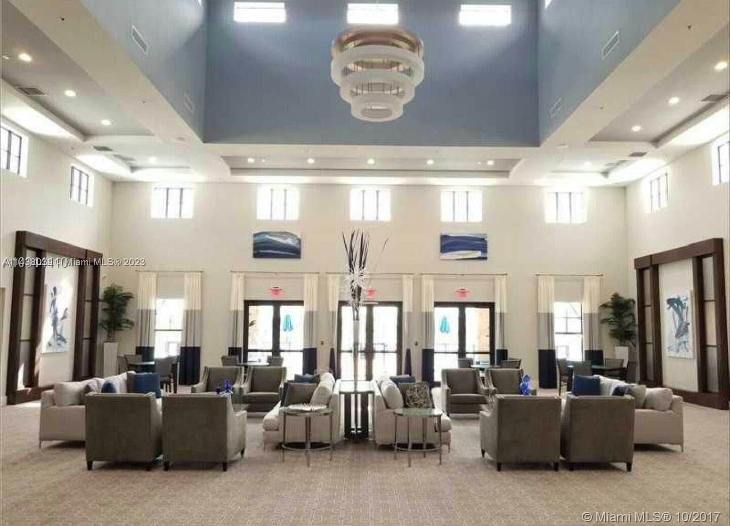 The Hammocks Miami, FL 33196 - Photo 5 of 34 a living room with furniture chandelier and a large window