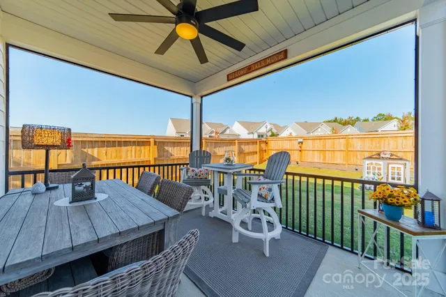 a view of a balcony with furniture