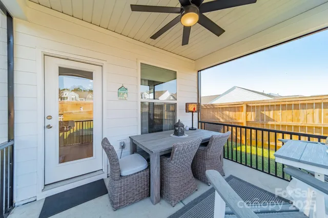 a dining room with furniture wooden floor and a chandelier