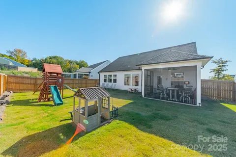 swimming pool with outdoor seating and yard