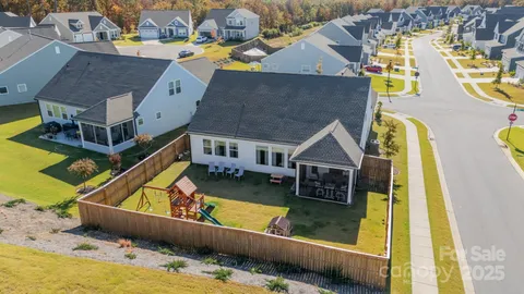 an aerial view of residential houses with swimming pool