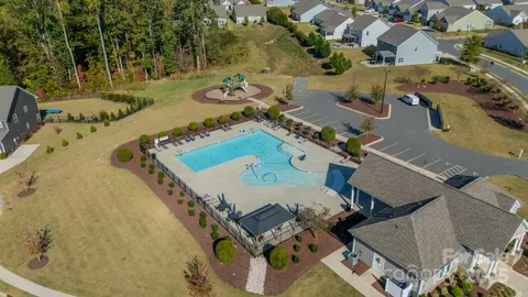 an aerial view of a house with outdoor space