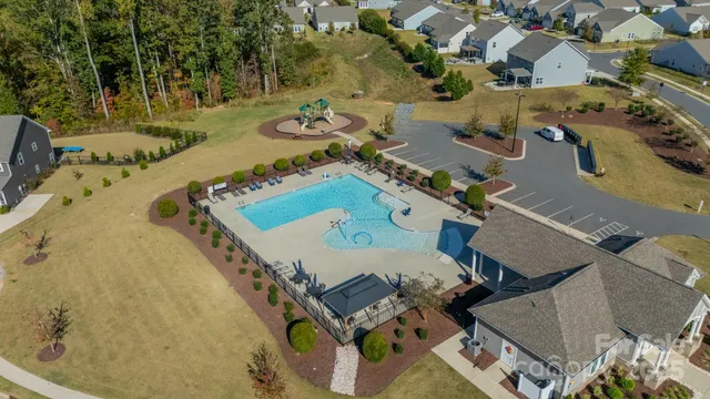 an aerial view of a house with outdoor space