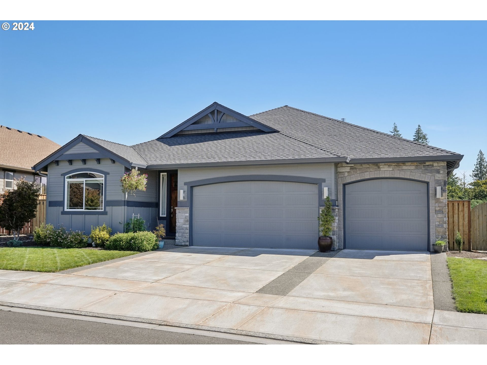 1701 South Nighthawk Road Ridgefield, WA 98642 - Photo 1 of 45 a front view of a house with a yard and garage