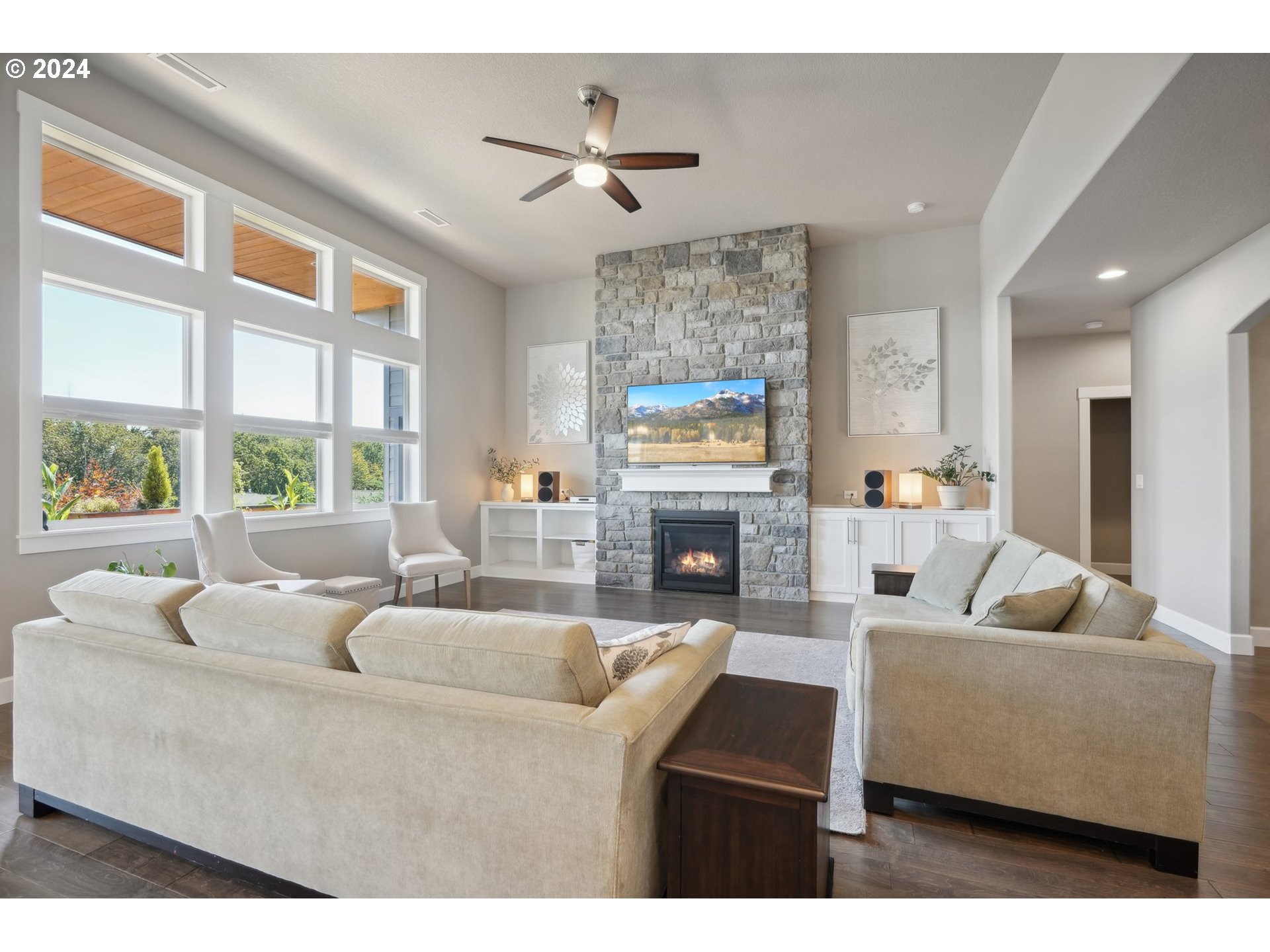 1701 South Nighthawk Road Ridgefield, WA 98642 - Photo 11 of 45 a living room with furniture a fireplace and a large window