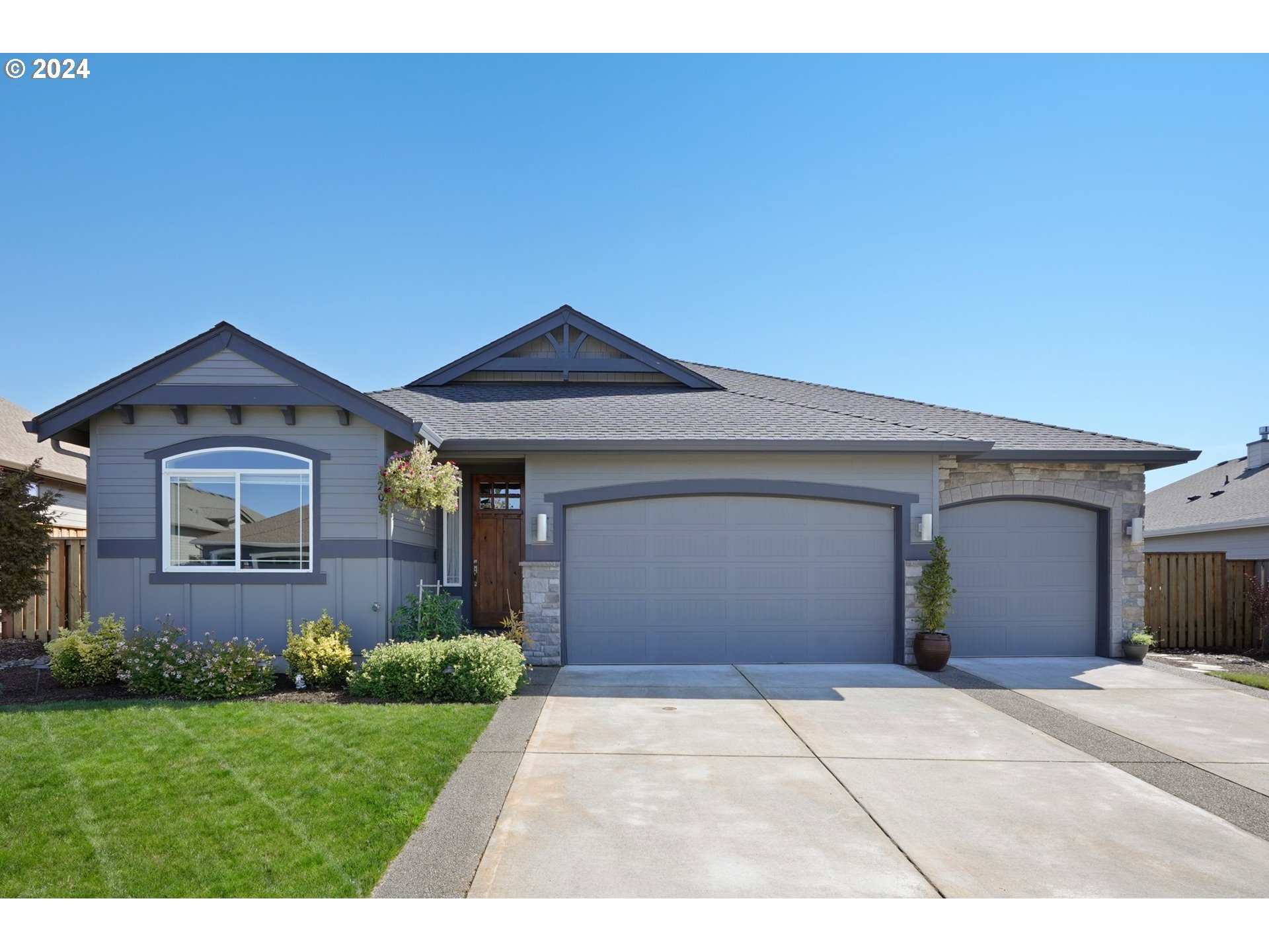 1701 South Nighthawk Road Ridgefield, WA 98642 - Photo 2 of 45 a front view of a house with a yard and garage