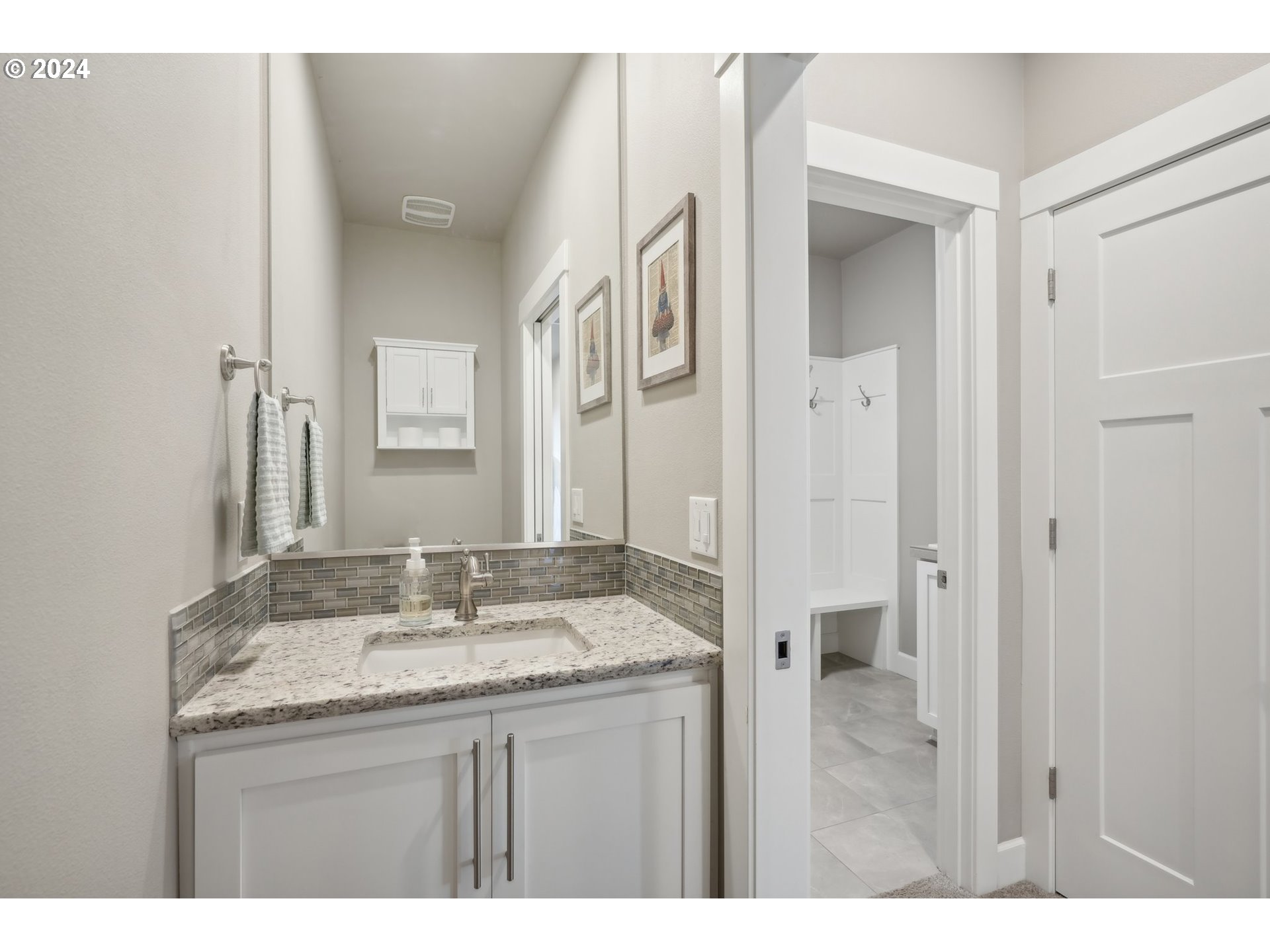 1701 South Nighthawk Road Ridgefield, WA 98642 - Photo 21 of 45 a bathroom with a granite countertop sink a mirror and a