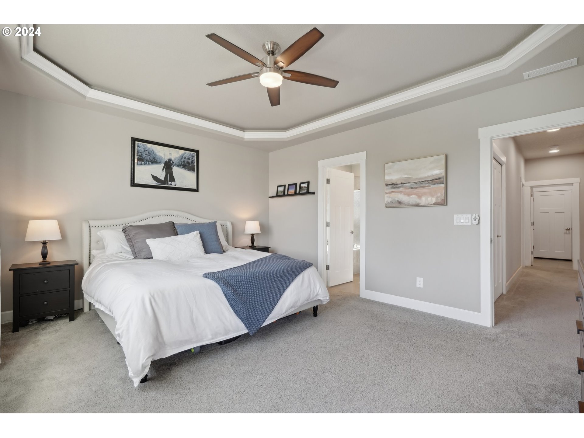 1701 South Nighthawk Road Ridgefield, WA 98642 - Photo 24 of 45 a bedroom with a bed and a ceiling fan