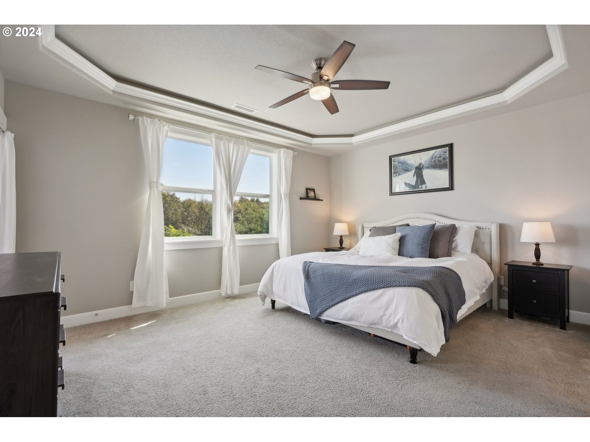 1701 South Nighthawk Road Ridgefield, WA 98642 - Photo 25 of 45 a bedroom with a large bed and a window