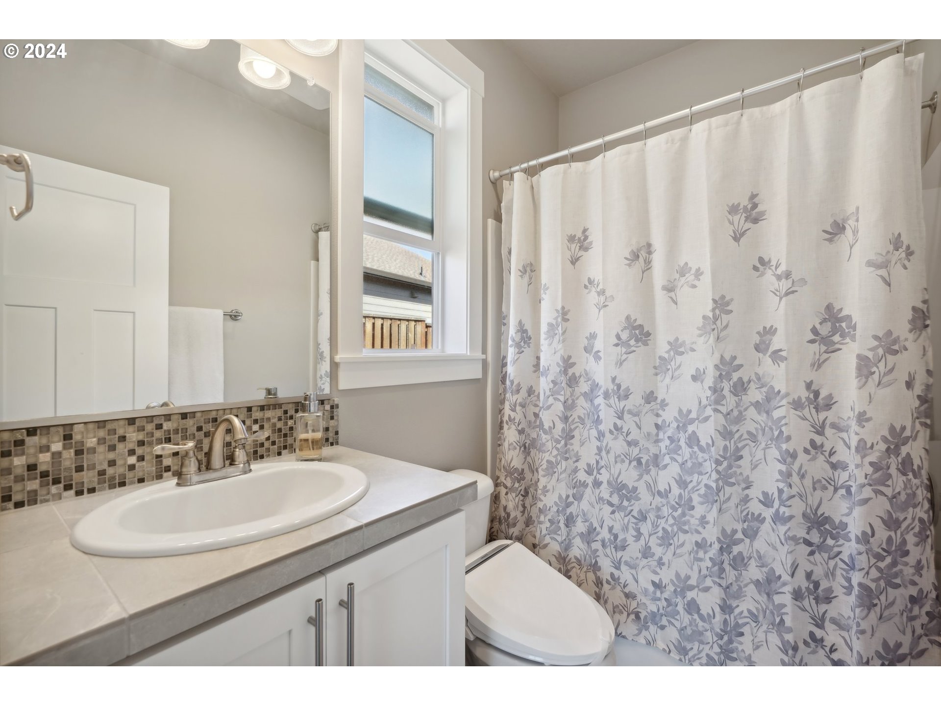 1701 South Nighthawk Road Ridgefield, WA 98642 - Photo 32 of 45 a bathroom with a sink and a mirror