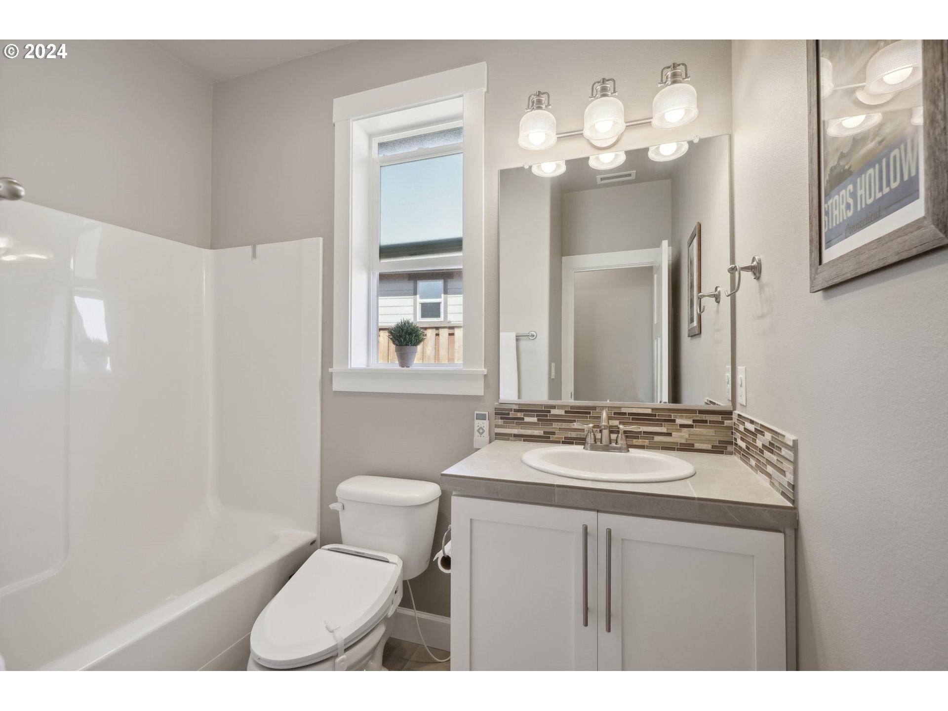 1701 South Nighthawk Road Ridgefield, WA 98642 - Photo 34 of 45 a bathroom with a sink vanity mirror and toilet