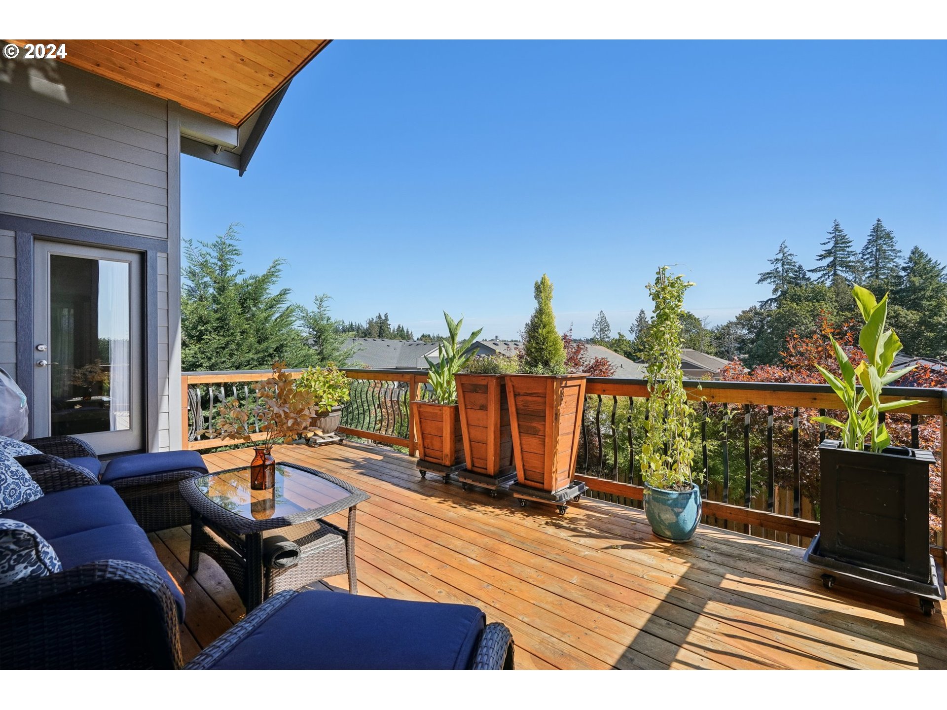 1701 South Nighthawk Road Ridgefield, WA 98642 - Photo 36 of 45 a view of a balcony with wooden floor and outdoor seating