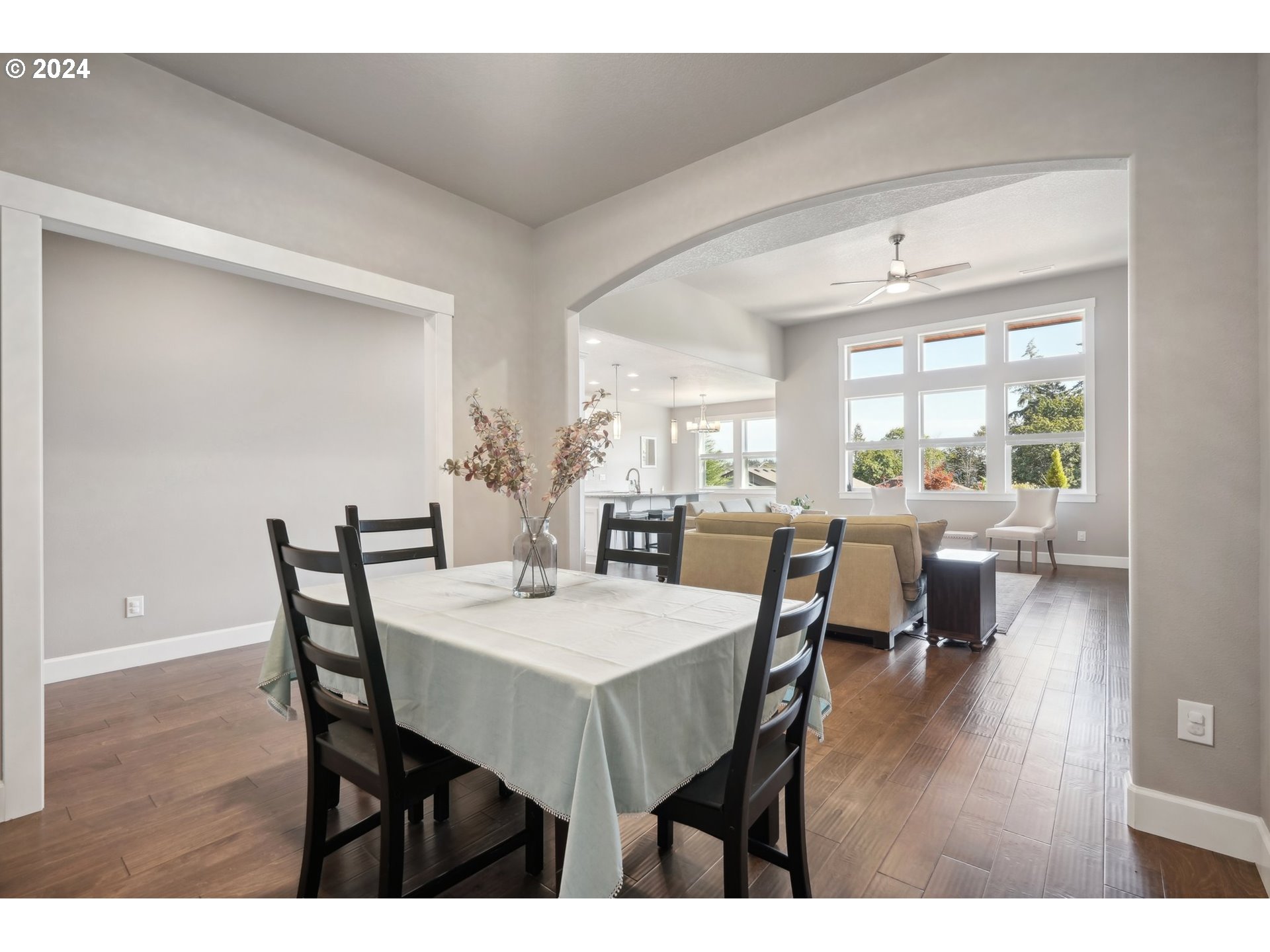 1701 South Nighthawk Road Ridgefield, WA 98642 - Photo 5 of 45 a view of a dining room with furniture and wooden floor