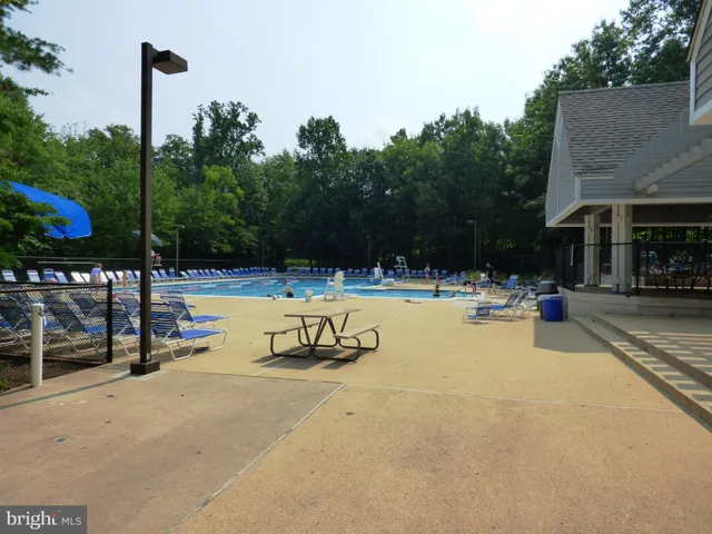 a view of a park with iron fence