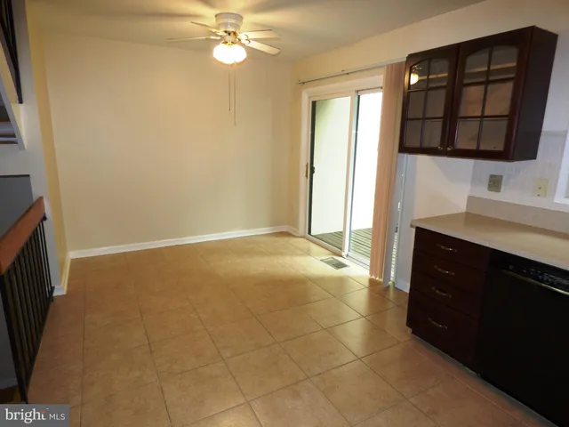 a kitchen with stainless steel appliances granite countertop a refrigerator a stove top oven and sink