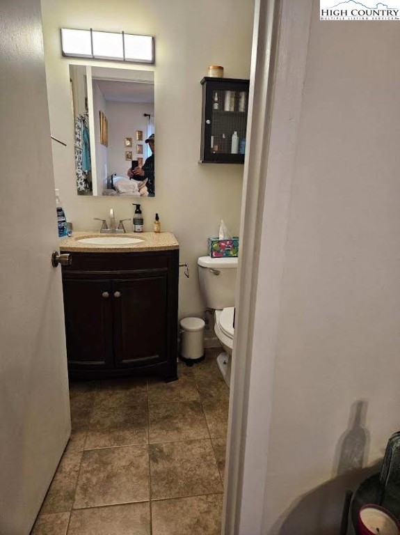 116 Grand Boulevard, Unit 1M Boone, NC 28607 - Photo 13 of 14 a bathroom with a sink and a mirror